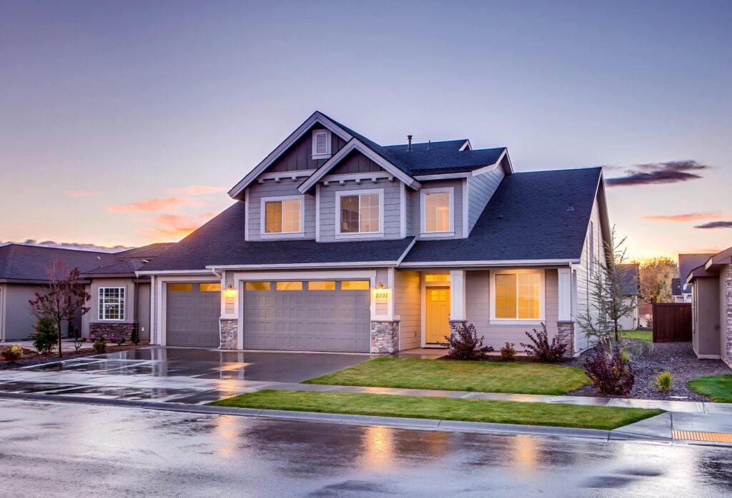 pexels-photo-186077-186077-1 Elegant suburban home with driveway at sunset showcasing modern architecture.